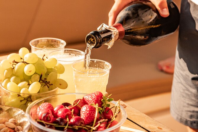 Aperitif on a boat at sunset in the Gulf of Naples - Sunset drinks, fruit, and the small-boat feel