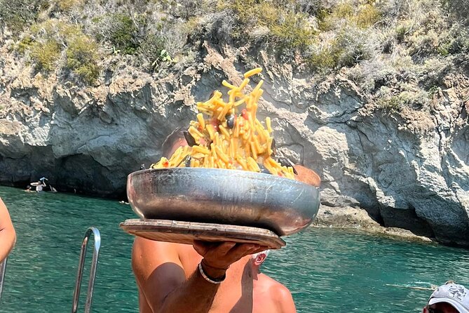 Boat tour of the island of Ischia with lunch and bath - Lunch with fish, fruit, and wine