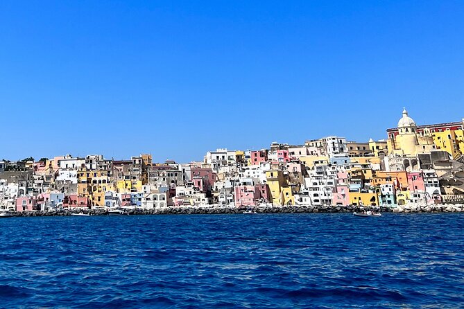 Boat Tour to Procida and Ischia, discover Private Secret Beaches - Punta di Pioppeto, where flat rocks replace sand