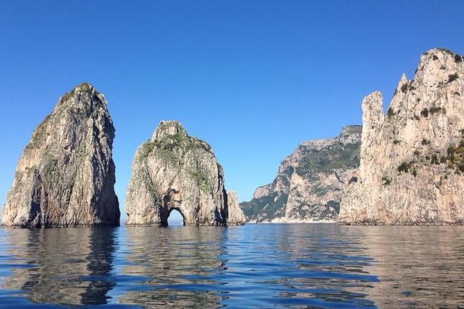 From Naples: Capri Island Tour with Lunch and Blue Grotto - Seeing the Faraglioni from the water