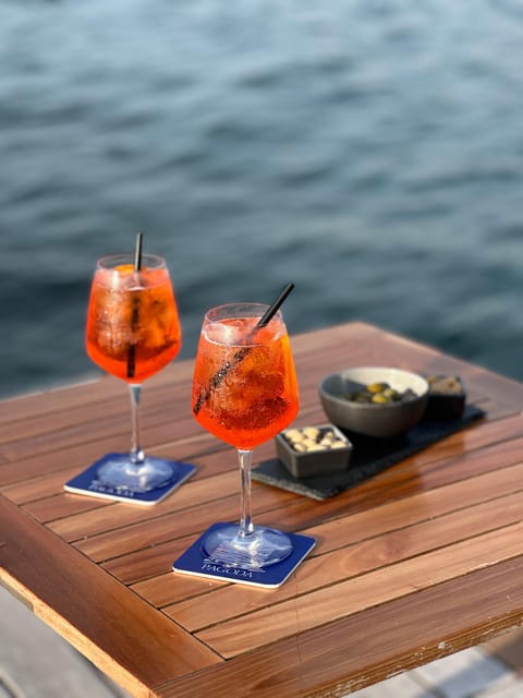 Italian aperitif at the sunset by the sea - A seaside aperitif built around the view