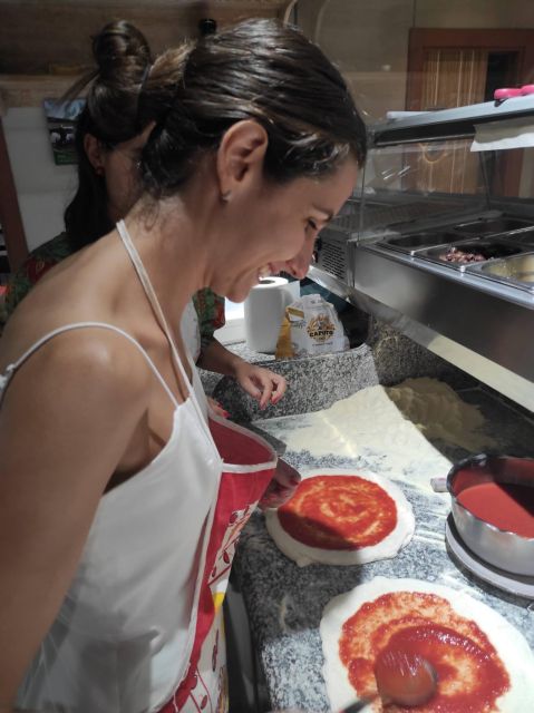 Naples: Small Group Pizza Making with Drink Included - Eating your pizza with a drink