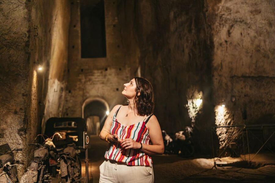 Naples: The Bourbon Tunnel Guided Tour with Entrance Ticket - Statues, cars, and motorcycles in the darkness