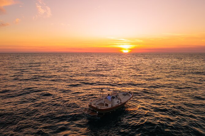 Private sunset boat tour in Ischia - Citara, Scannella, and Sorgeto from the water