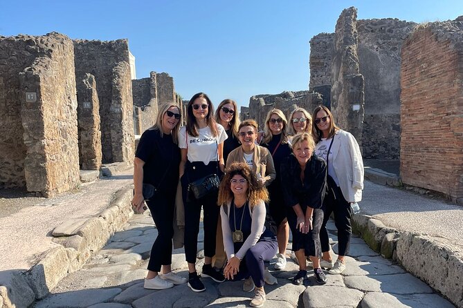 Skip-The-Line Tickets VIP Small Group Tour To Pompei and Vesuvius - Walking through Pompeii with a local guide
