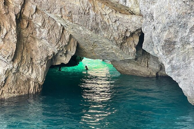 Small Group Tour from Rome to Blue Grotto, Anacapri and Capri - The Blue Grotto and its small wooden boat